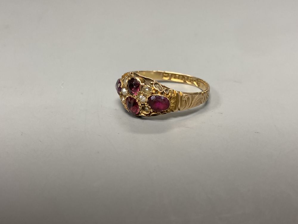 A Victorian 15ct gold, garnet and seed pearl cluster dress ring, size N, gross 1.8 grams, another ring and a bar brooch.